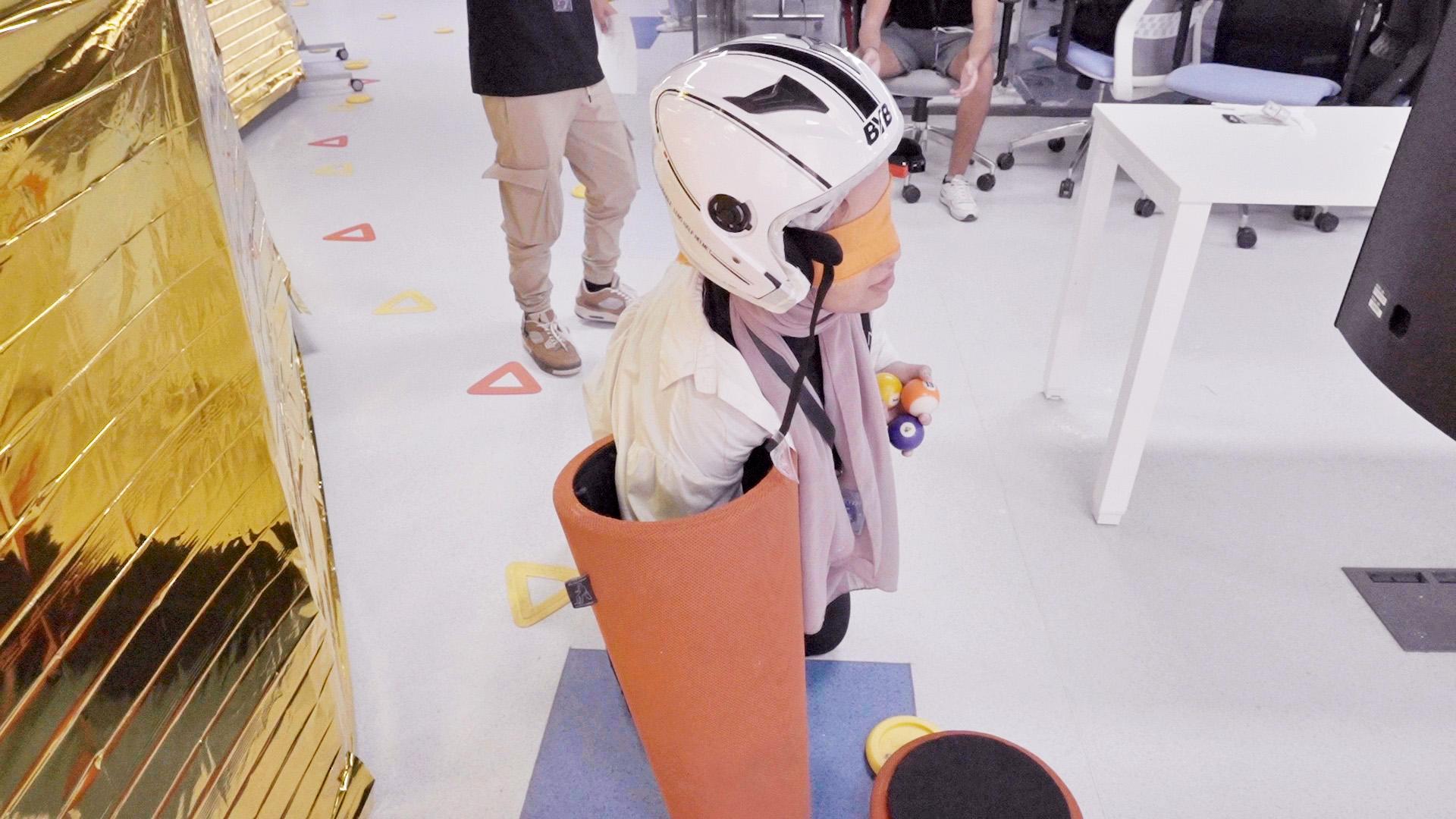 Campers working on astronaut challenges in teams